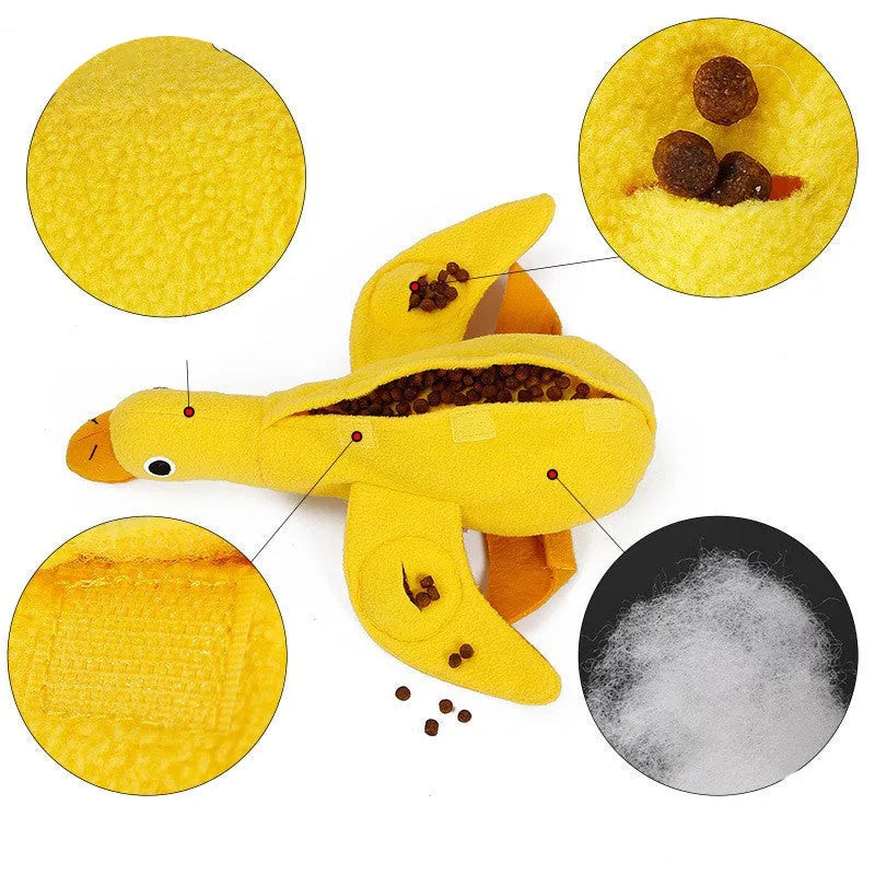 Yellow teddy dog training toy with integrated duck doll and food leak compartments