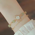 Women's copper butterfly bracelet with electroplated yellow gold finish and geometric design