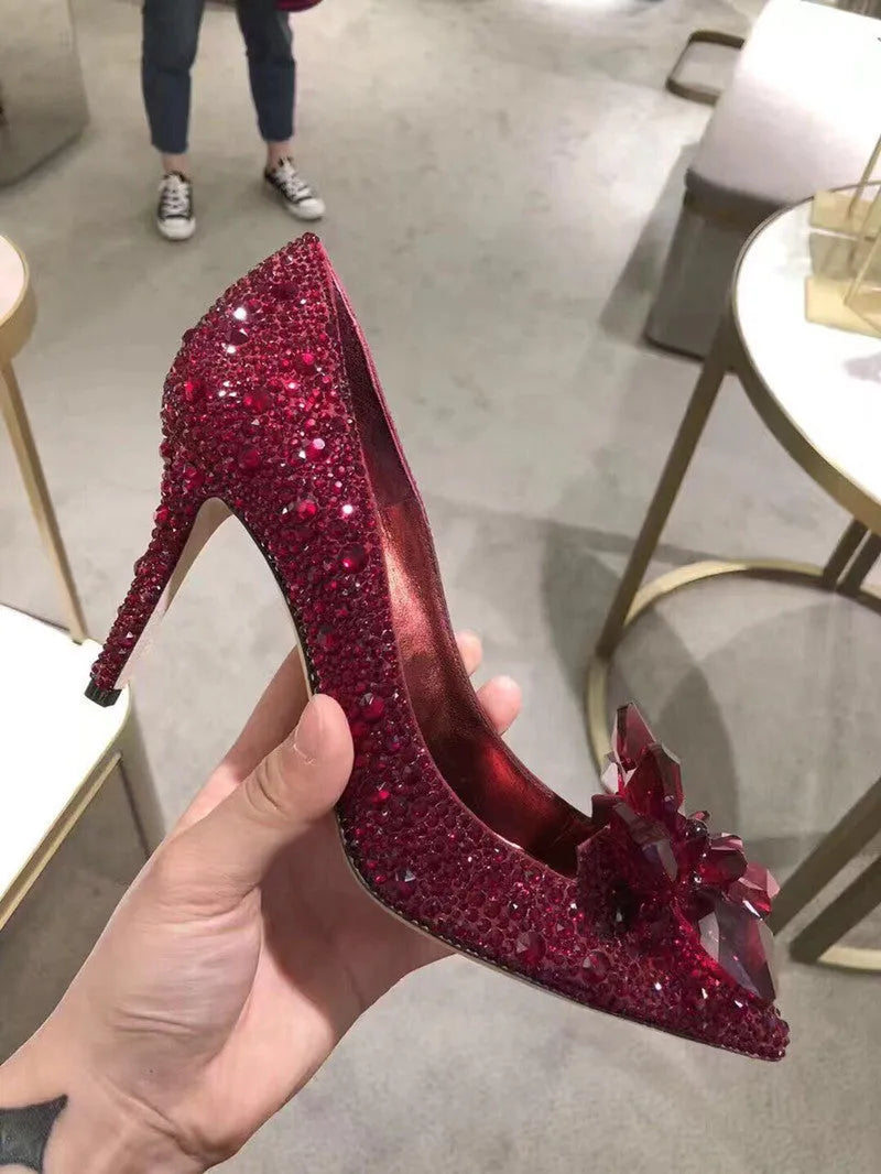 Women's gold high heels with pointed toe, rhinestone decoration, and stiletto heel