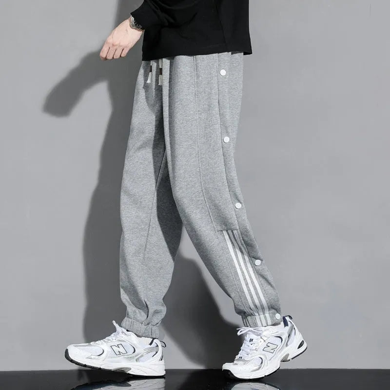 Men's black cotton blend sweatpants with high waist, belt, and adjustable ankle ties
