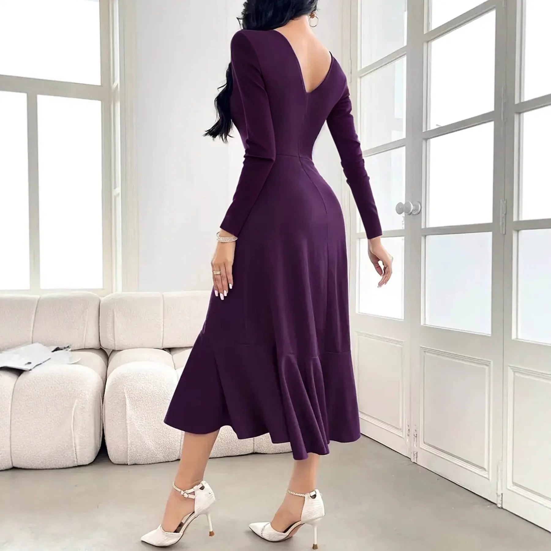 Purple women's long sleeve pullover dress with round neck and ruffle details on mannequin