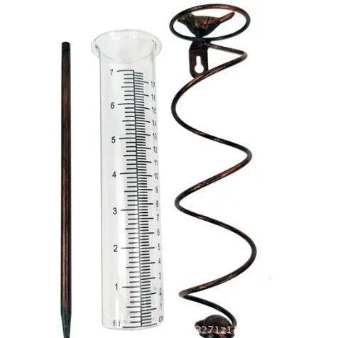 Cast iron garden rain gauge with glass tube and hummingbird decoration, showing 1-20 measurement scale.