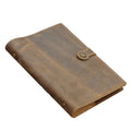 A5 handmade cowhide leather loose-leaf notebook in black with 100 sheets of kraft paper on a desk