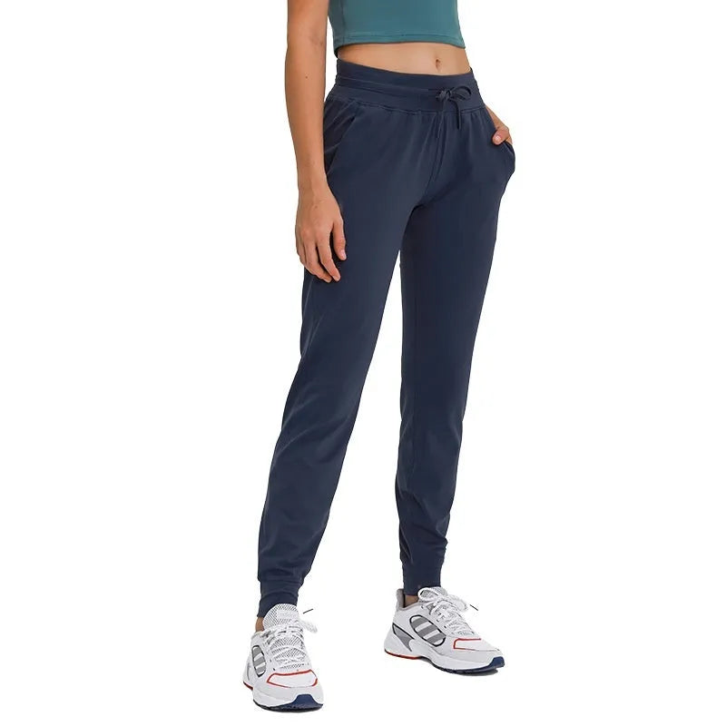Women's high waist yoga pants with drawstring waistband in quick-drying nylon blend fabric