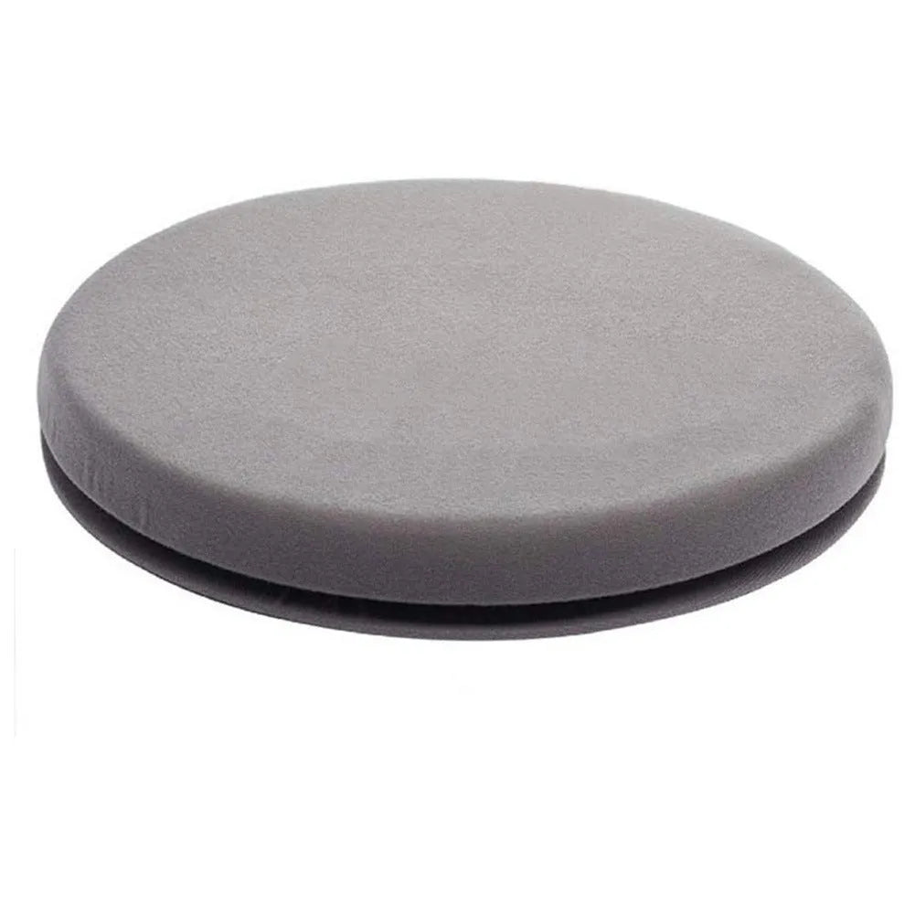 Grey rotating car seat cushion with non-slip base on a car seat.