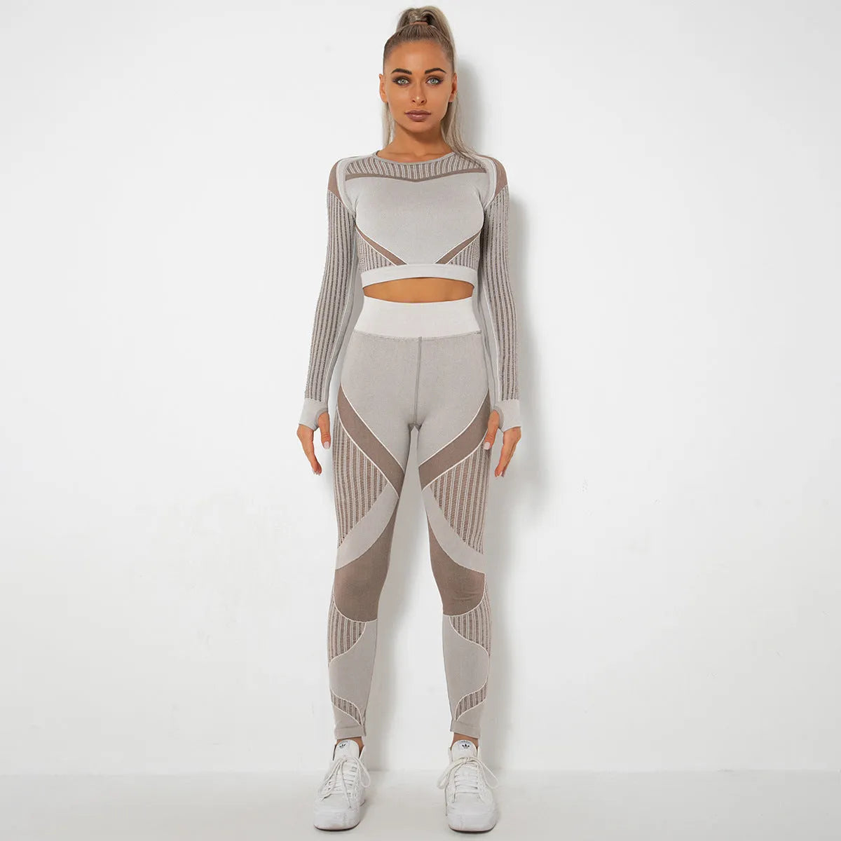 Women's seamless knitted long sleeve yoga wearsuit in a striped pattern, shown in a neutral colour.