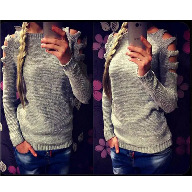 Women's grey rabbit fur hollow-out knitted long sleeve pullover shirt on a hanger.