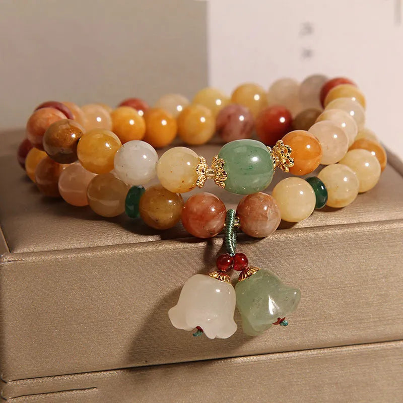 Women's natural jade multi-layer bracelet with orchid pendant detailing and jinsi construction