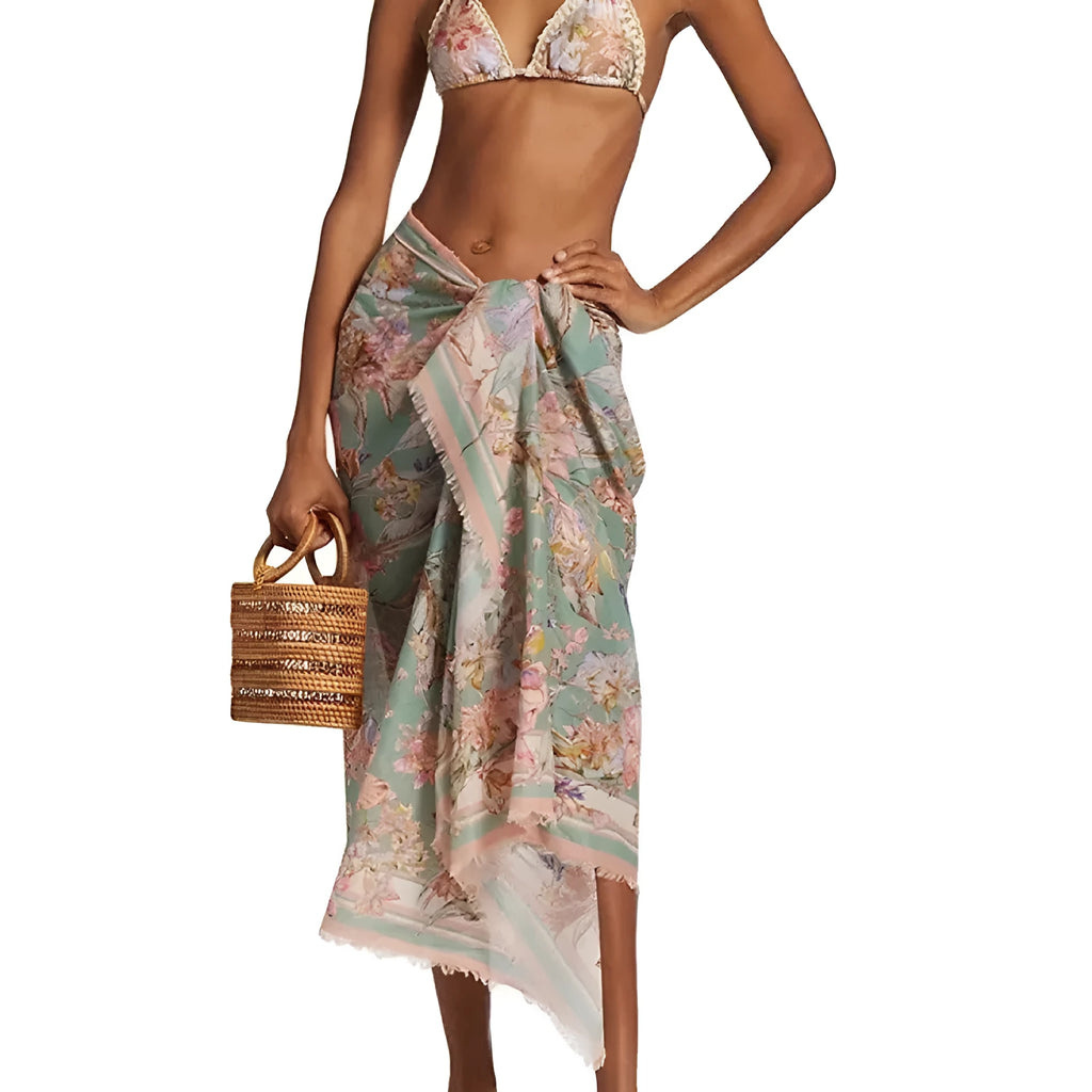 Women's creamy-white floral bikini set with top, briefs, and skirt for beach swimming