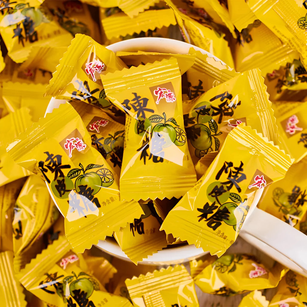 Bag of mixed hard candies in plum, guava, and tangerine peel flavours, total weight 1055g.