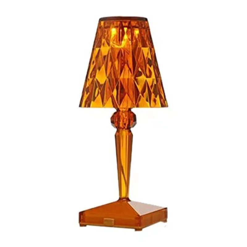 Rose gold portable touch night light on a surface, showing its acrylic body and modern design.