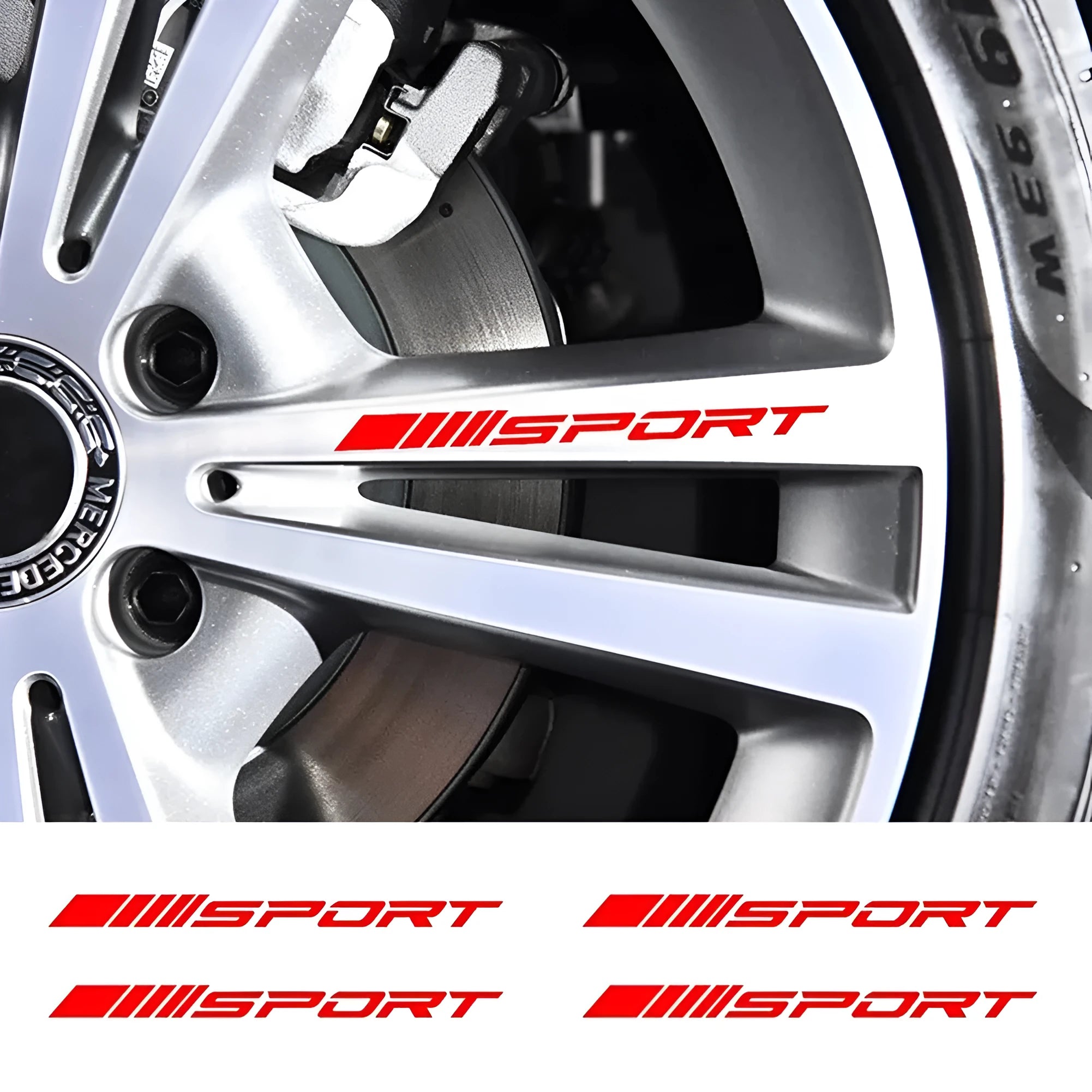 Red hollow sports design car rim sticker on a silver alloy wheel.