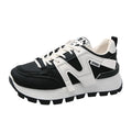 Artificial PU low top running sneakers in white and black colours with front lace-up design