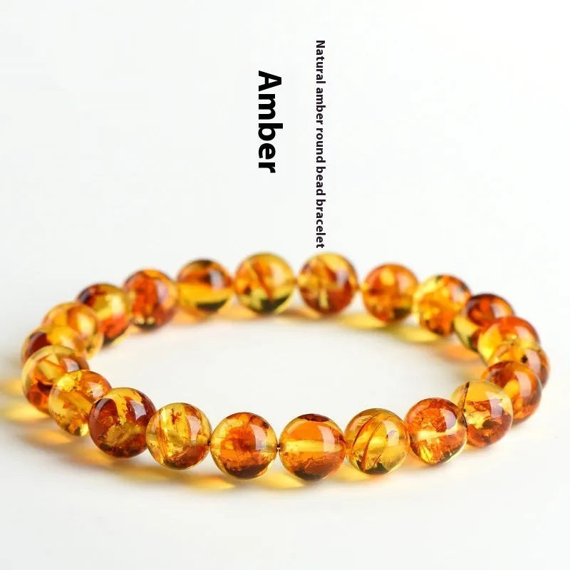 Natural yellow piebald amber bracelet with flower spot patterning in three bead size options