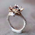 Women's two-tone floral geometric alloy ring in silver colour on display