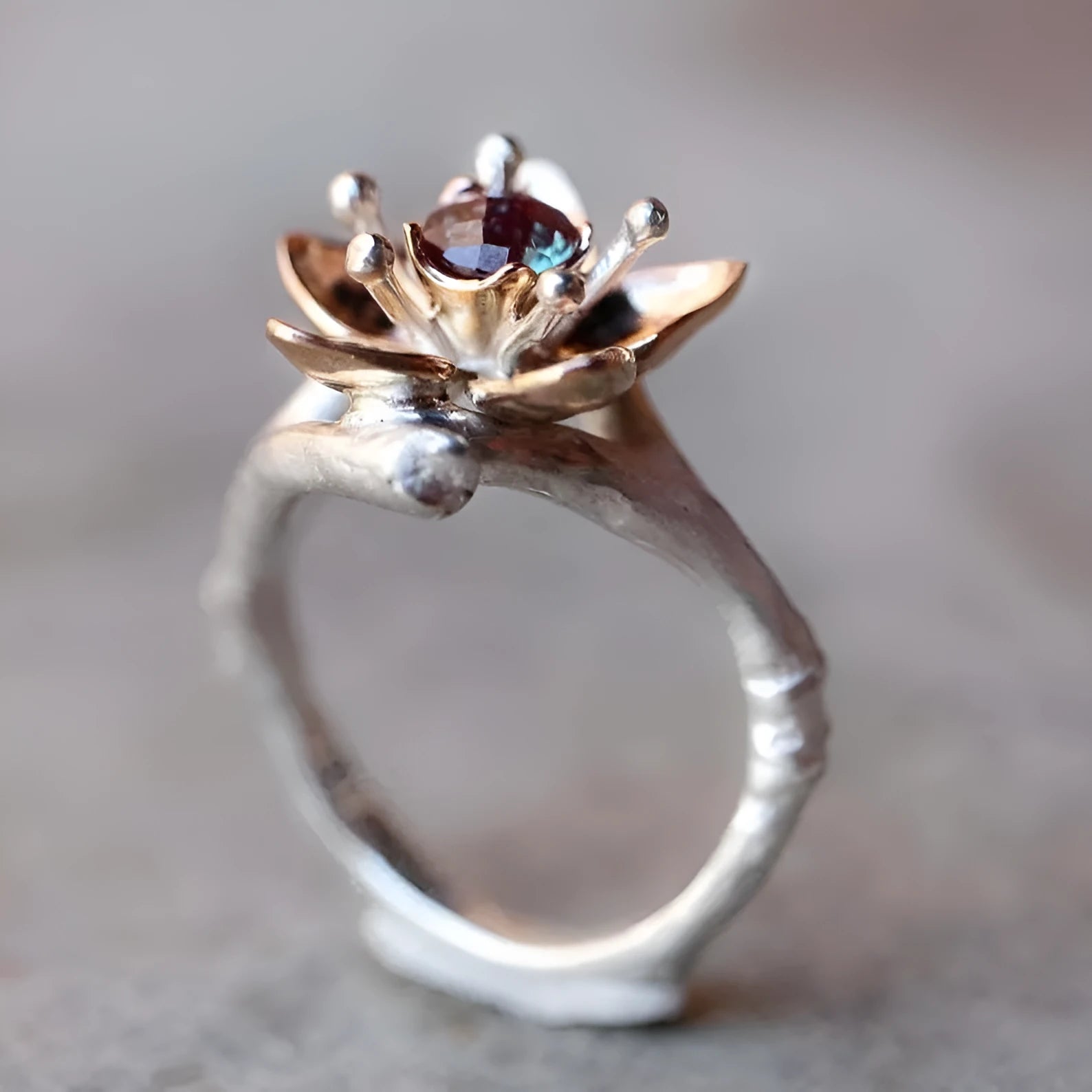Women's two-tone floral geometric alloy ring in silver colour on display
