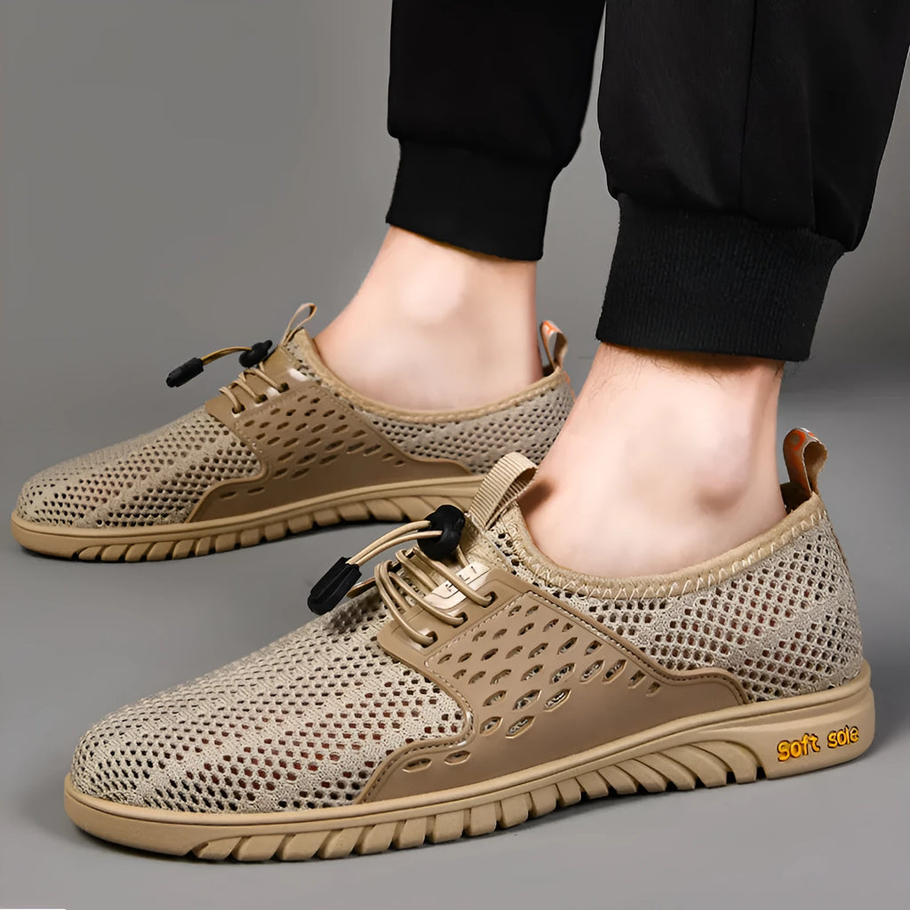 Men's black mesh casual shoes with elastic band and rubber sole on a white background