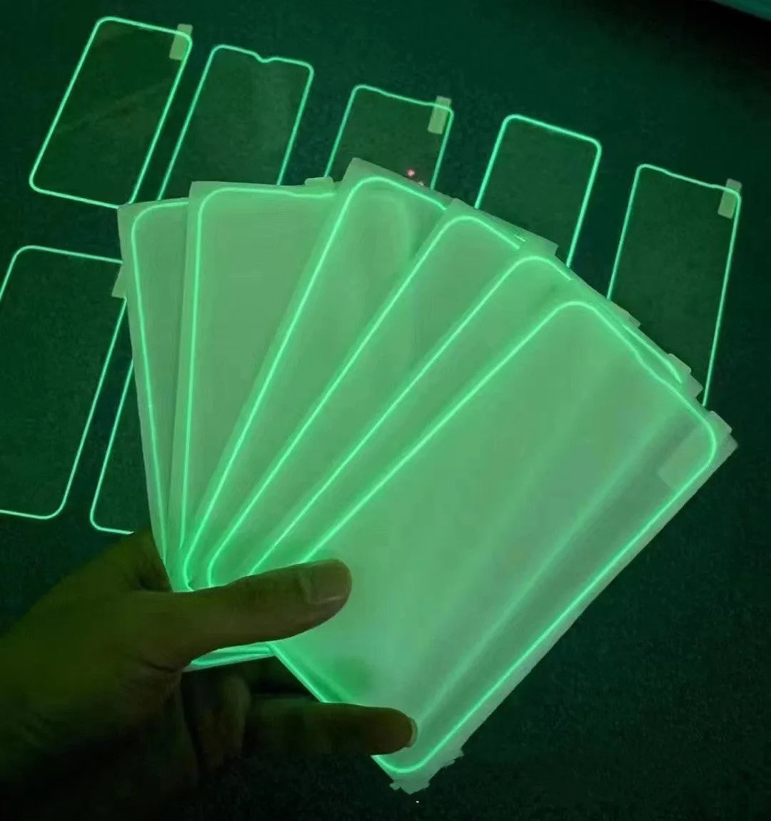 Fluorescent luminous tempered glass screen protector for iPhone on a phone.