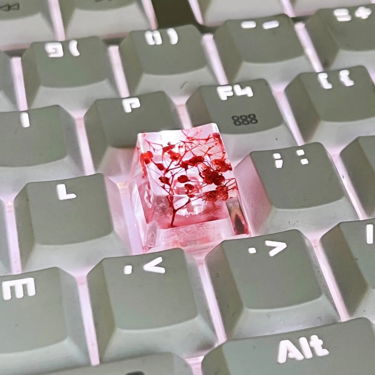 Transparent resin mechanical keyboard keycap with starry sky design in one of four colour options