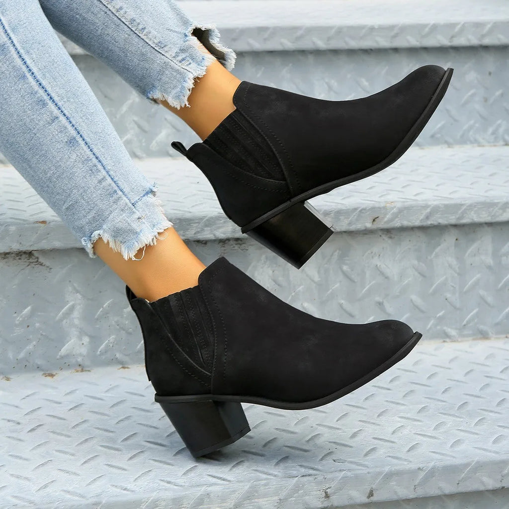 Women's black slip-on ankle boots with pointed toe and thick square heel