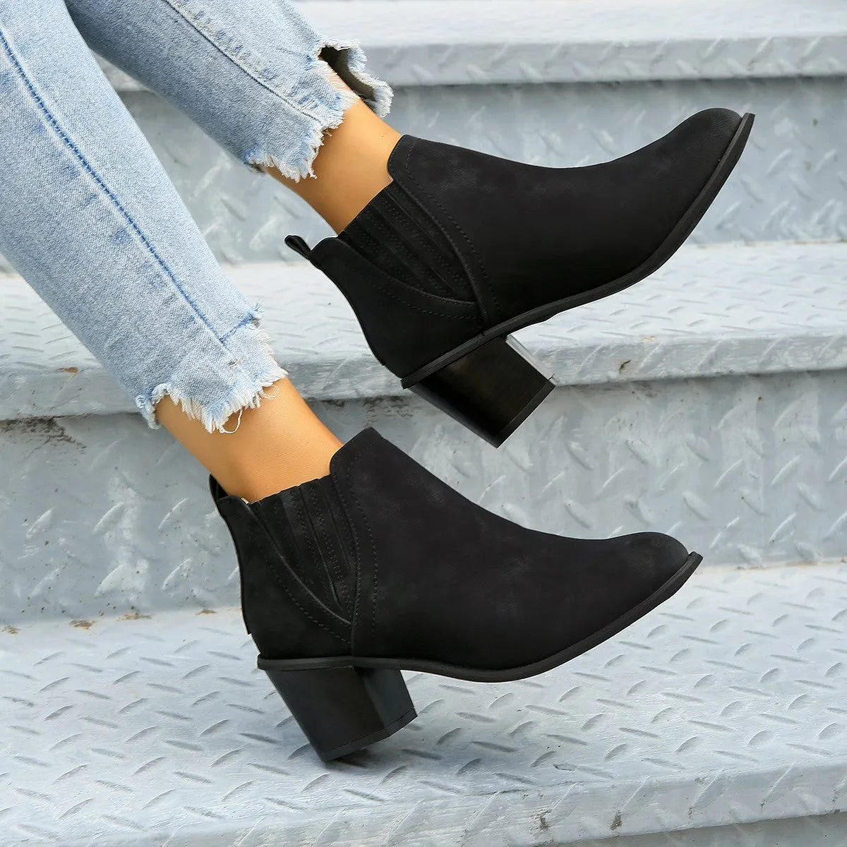 Women's black slip-on ankle boots with pointed toe and thick square heel