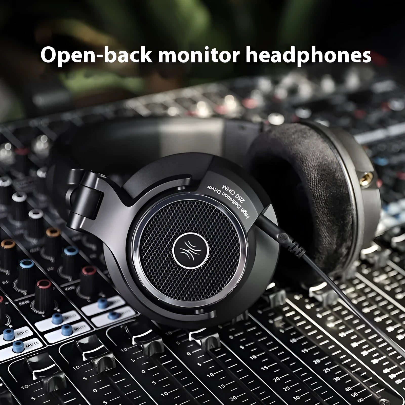 Wired noise reduction monitor headset with 40mm driver and dual 3.5mm/6.5mm plugs on black background