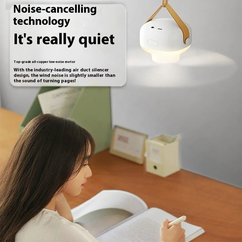 White rechargeable ceiling camping fan with remote control and mounting strap on a 3m wire bracket.