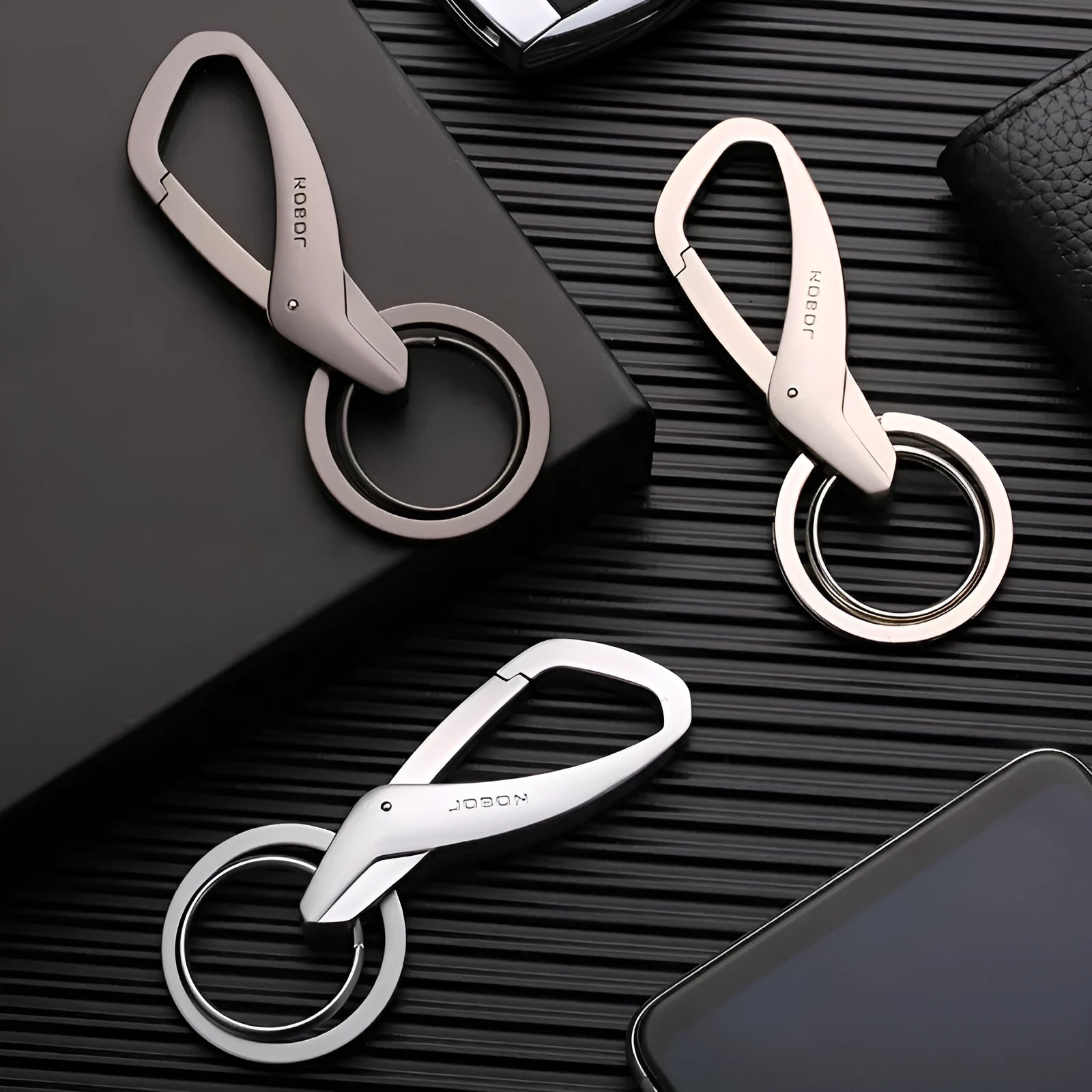 Zinc alloy car key waist hanging double ring keychain in black, chrome, or nickel colour showing 8.3cm x 3.5cm dimensions