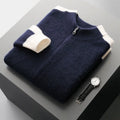 Man wearing a dark blue loose-fit wool zip cardigan with a half-turtleneck collar.