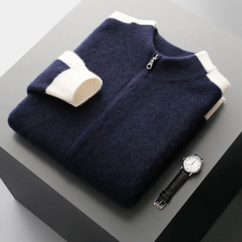 Man wearing a dark blue loose-fit wool zip cardigan with a half-turtleneck collar.