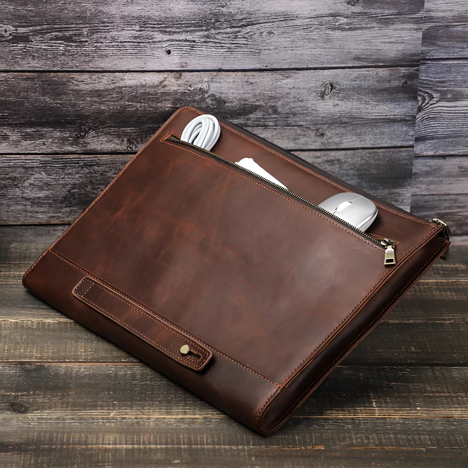 Crazy Horse oil leather zipper laptop bag in coffee colour on a wooden surface