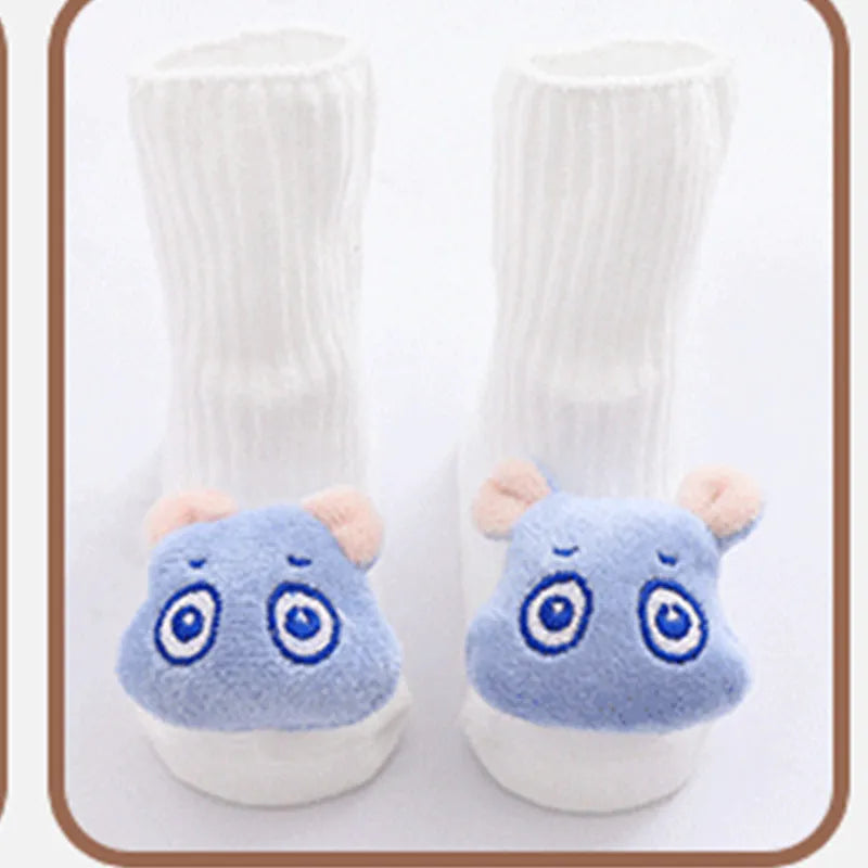 Cotton baby floor socks in blue bow pattern for infants 0-3 months.