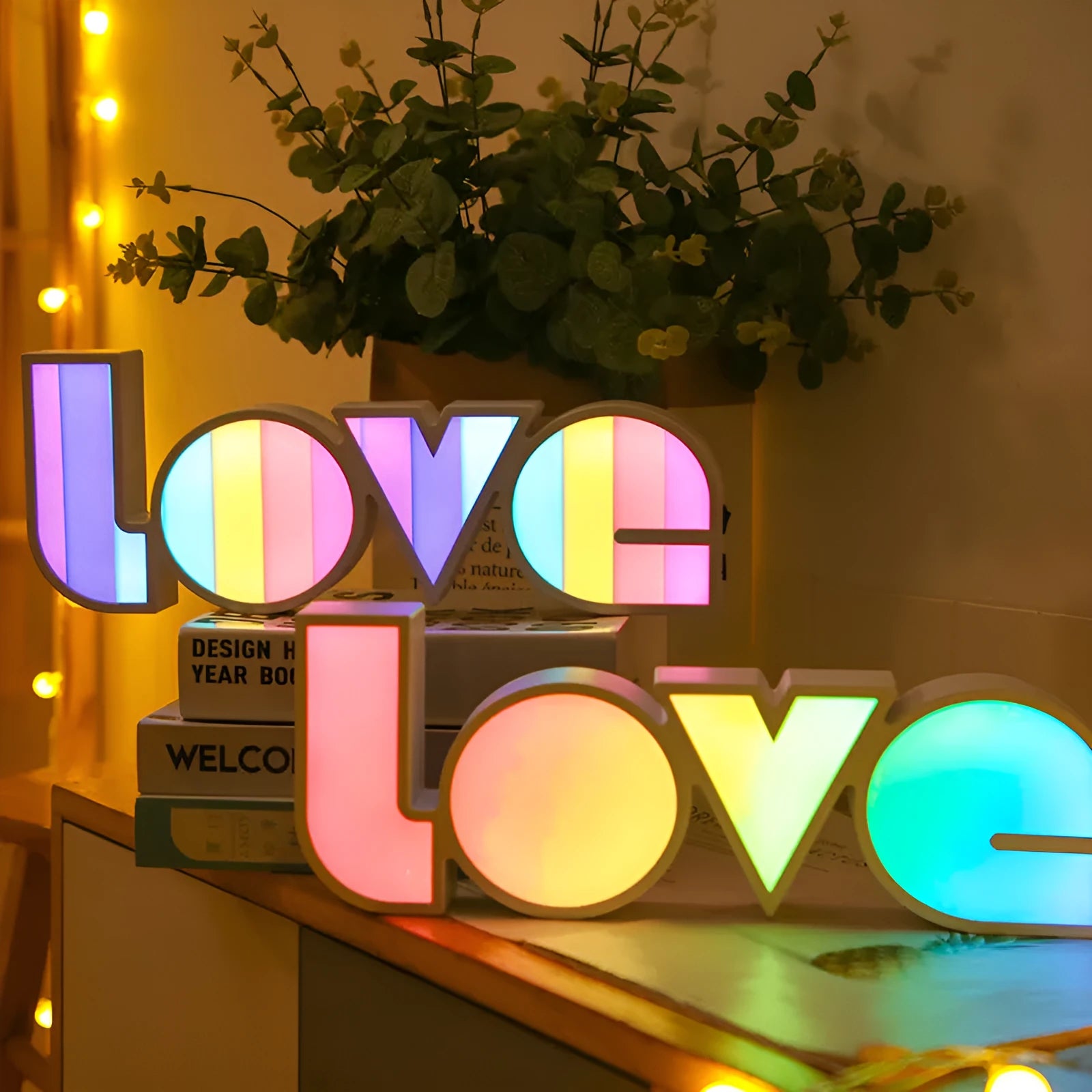 Colourful rainbow LED decorative light spelling LOVE, with USB cable, for Valentine's Day or wedding decor.