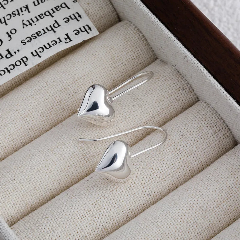 Women's silver heart-shaped earrings with glossy three-dimensional Korean-style design