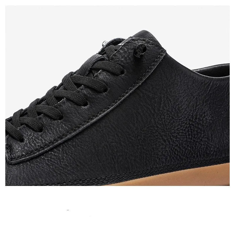 Men's black leather lace-up casual shoes with a round toe and flat rubber sole on a white background.