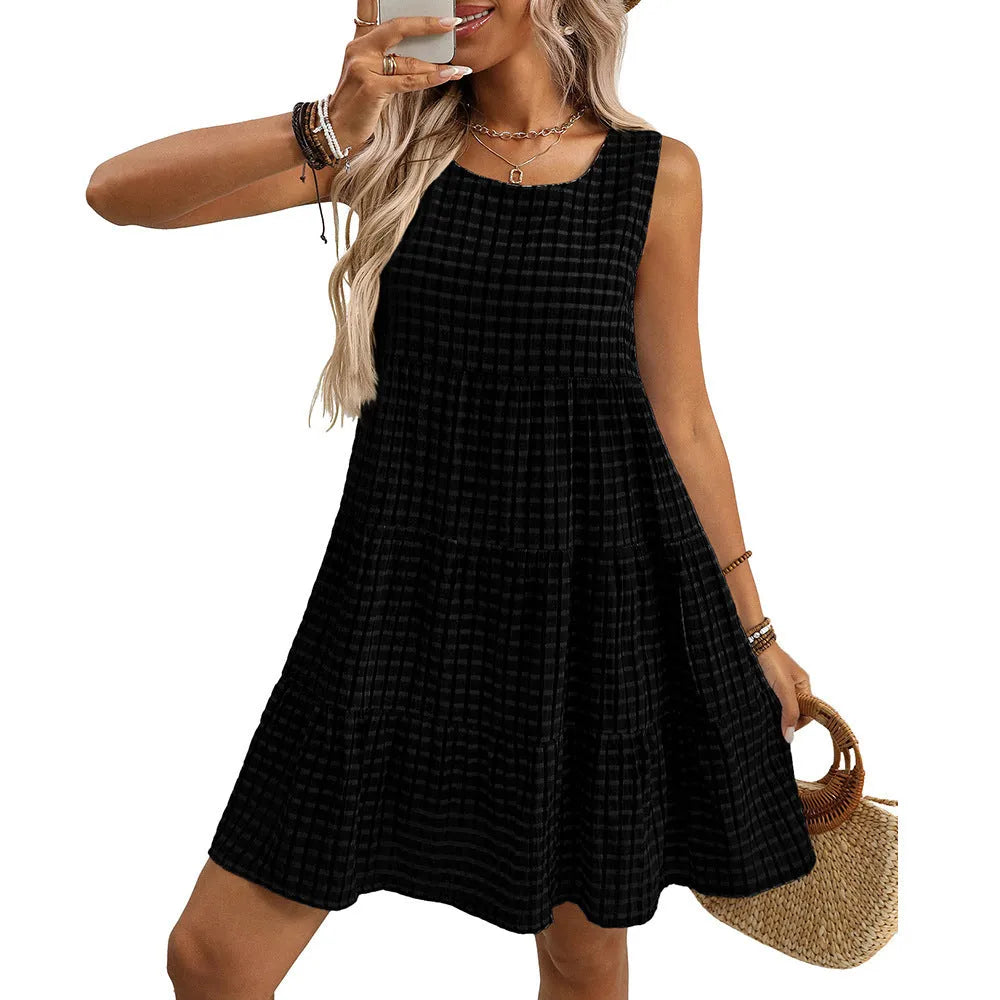 Women's loose-fitting sleeveless plaid dress with an oversized swing skirt on a hanger.