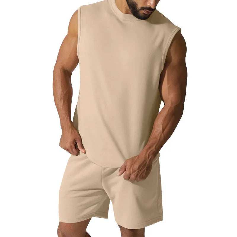 Men's sleeveless cotton blend sports suit showing top and shorts in a solid colour.