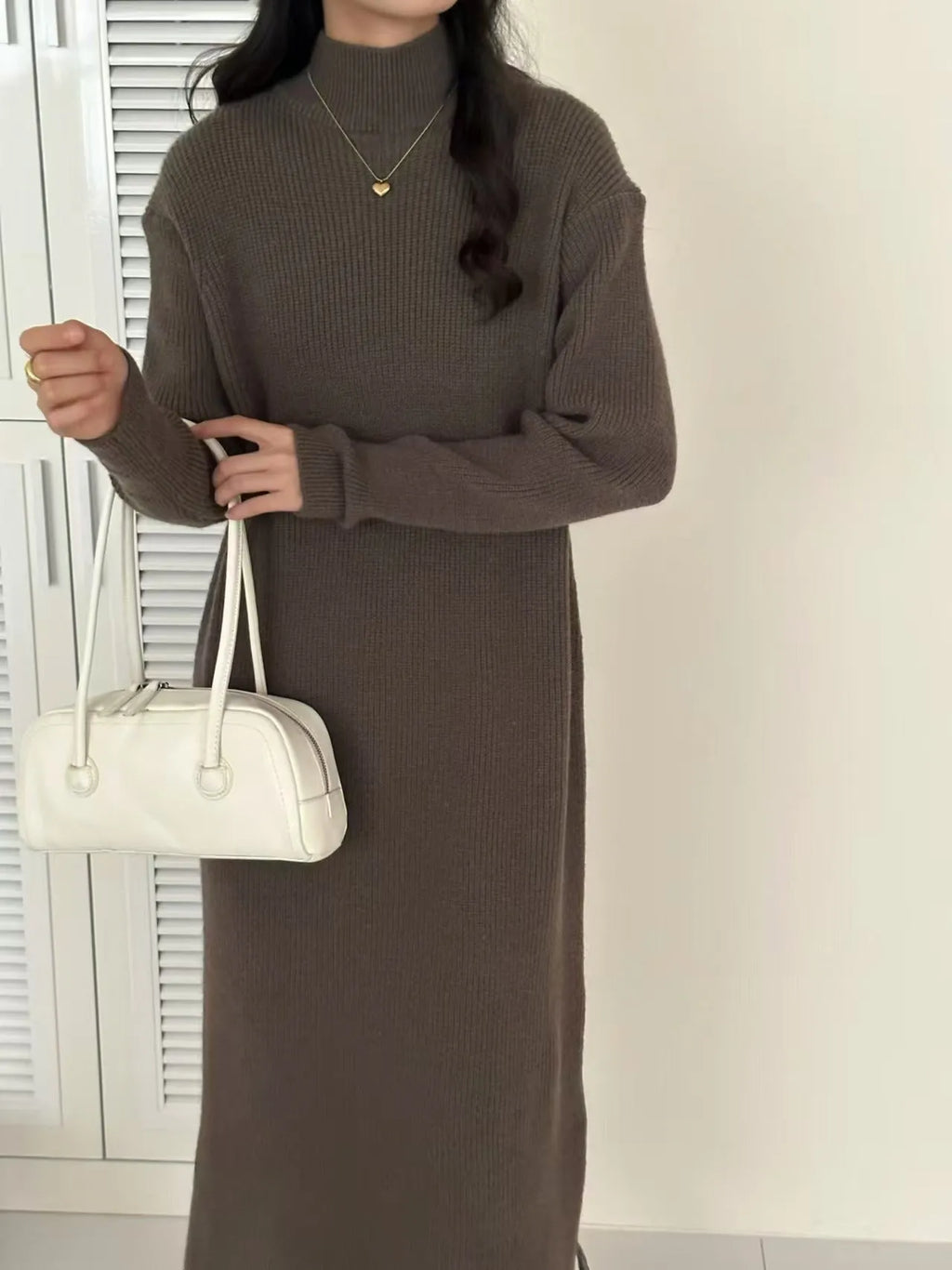 Knee-length acrylic knitted dress with half turtleneck collar and high-waist design