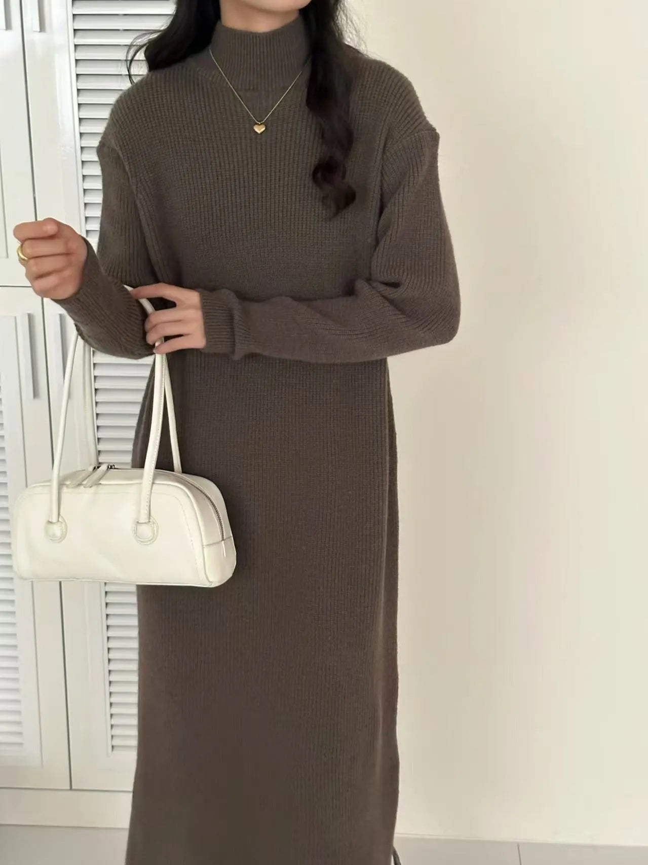 Knee-length acrylic knitted dress with half turtleneck collar and high-waist design