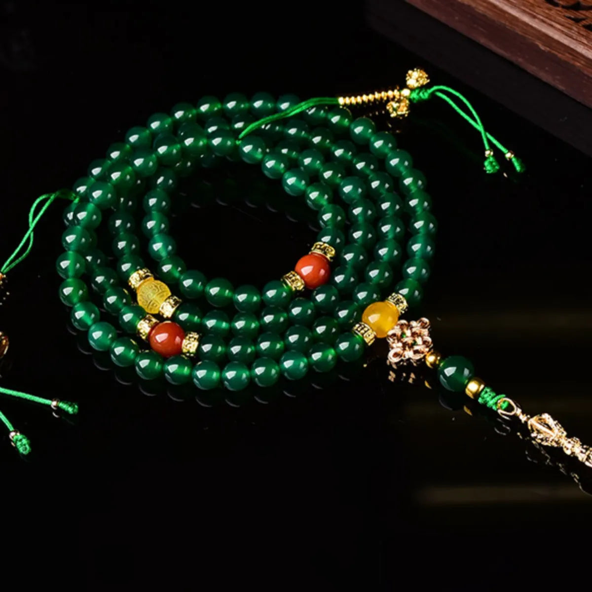 Handcrafted multi-strand bracelet with green agate beads from Brazil, showing size options.