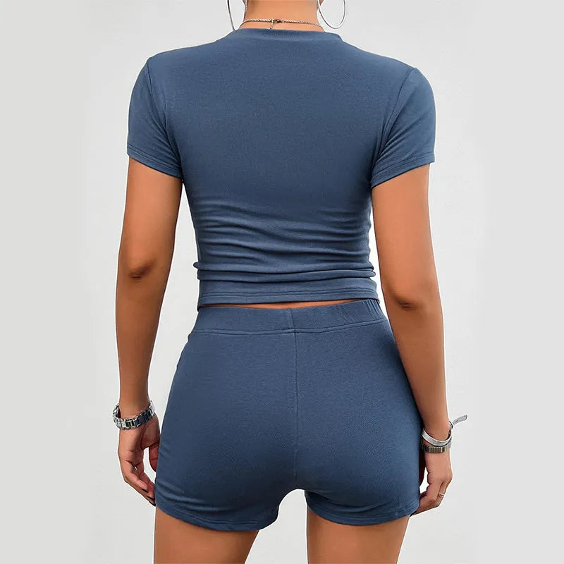 Women's solid colour slim fit viscose sports set with t-shirt and elastic shorts.