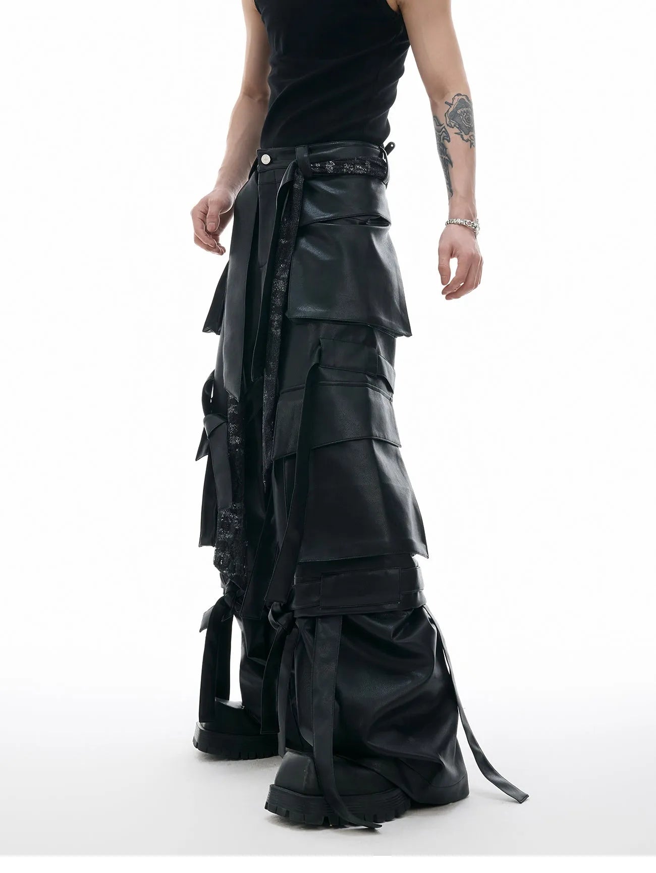 Black retro loose leather pants with quilted panels and multiple pockets