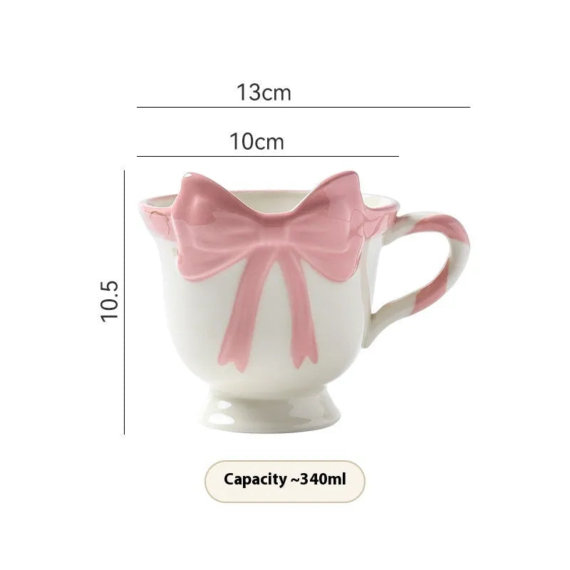 Ceramic mug with heart and bow design in Black Pink colour, showing 301-400ml capacity.