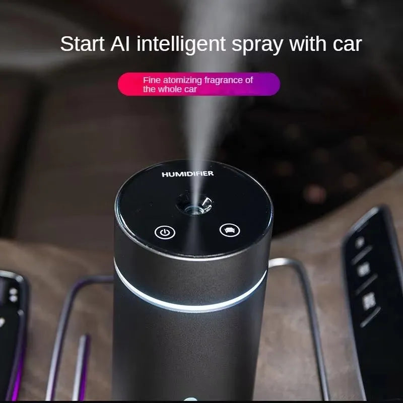 Aluminium portable car air humidifier and essential oil diffuser with multi-colour light on a black USB cable.