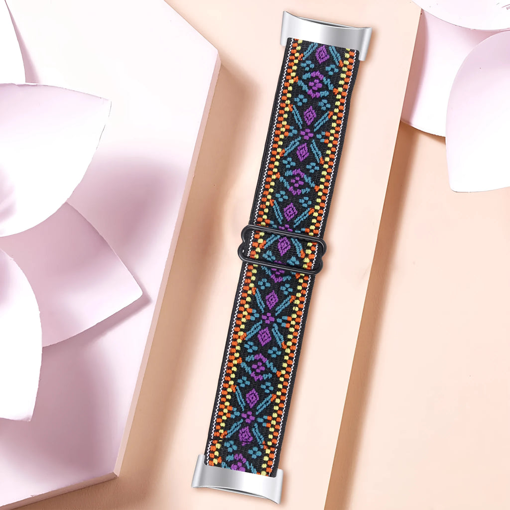 Printed elastic watch strap for Fitbit Charge 6 showing adjustable length and colourful pattern options