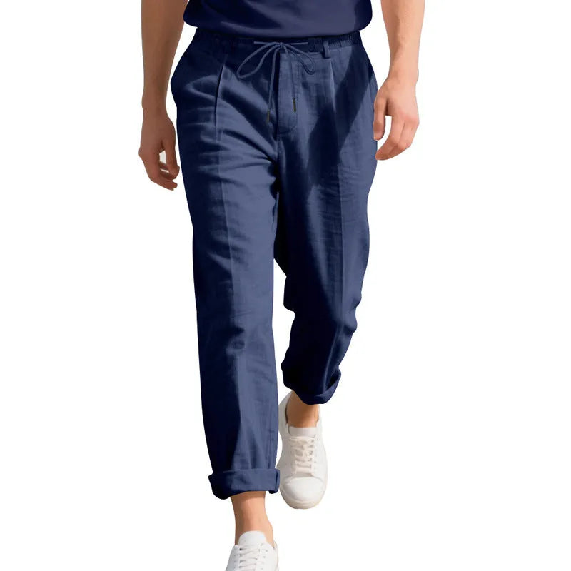 Men's light khaki linen casual trousers with a loose straight-leg fit and drawstring waist.