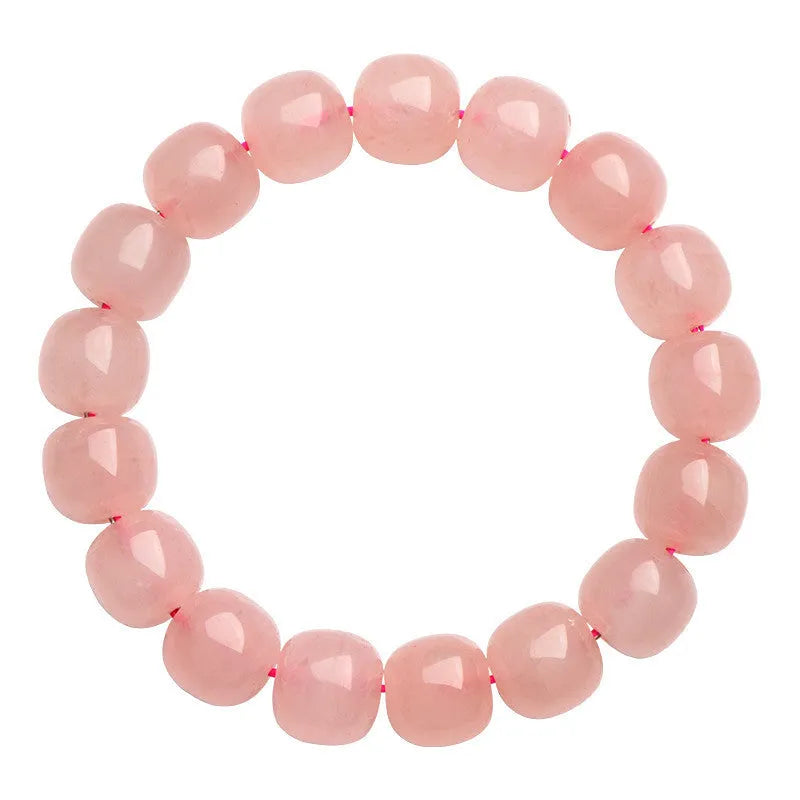 Pink natural crystal barrel bead bracelet with geometric shapes measuring 8-10mm