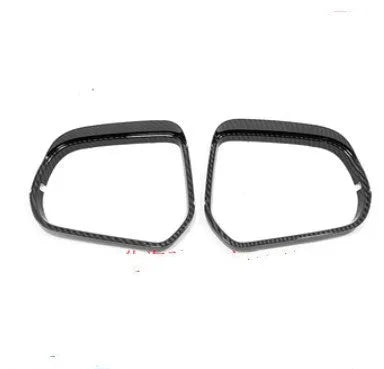 Pair of plastic rearview mirror covers in silver and black finishes for car styling.
