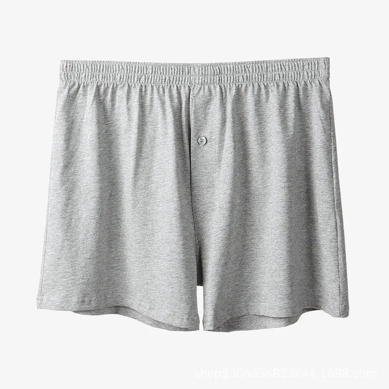 Men's solid colour cotton boxer shorts with a high waistband and loose leg.