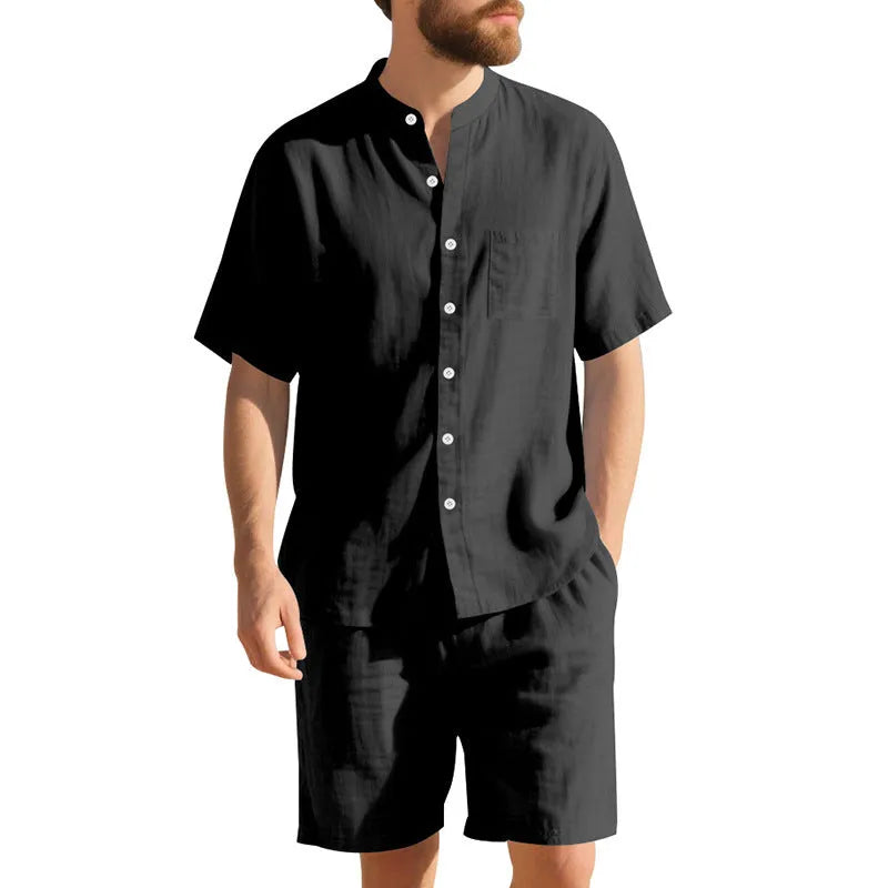 Men's light blue linen blend two-piece suit with short sleeve shirt jacket and shorts on a hanger.